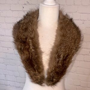 Mink stole. Brownish / tan. In excellent condition approx 32 inches. Lined.